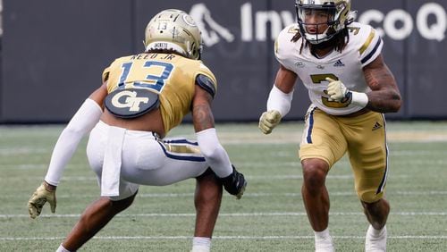 Defensive back Eric Reed Jr. lines up against wide receiver D.J. Moore in the fourth quarter during Georgia Tech's spring football game in Atlanta on Saturday, April 15, 2023.   (Bob Andres for The Atlanta Journal-Constitution)