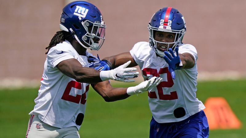 New York Giants cornerbacks Adoree' Jackson (right) fends off cornerback Logan Ryan (left) as they go through a drill during practice, Thursday, June 10, 2021, in East Rutherford, N.J. (Kathy Willens/AP)