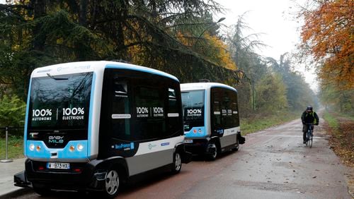 An electric driverless shuttle produced by EasyMile drives, as part of an experiment, in Paris on Friday. The fully electric autonomous vehicle is made by French company EasyMile, one of multiple French driverless car projects. AP/Christophe Ena