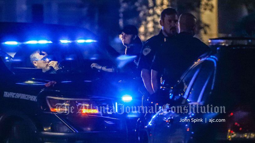 Alpharetta police work the scene of a fatal shooting at an apartment complex off Mansell and Old Roswell roads on Friday morning.