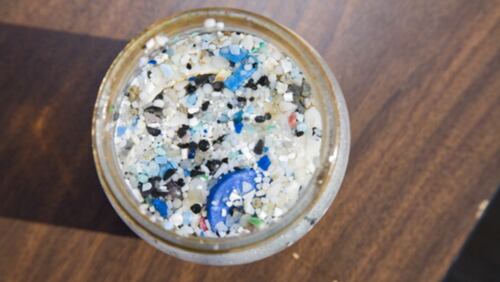 A picture of a sample jar containing examples of the tiny pieces of plastic polluting the Pacific Ocean. The Algalita Marine Research Foundation studies and educates the public about the effects of oceanic micro-plastic pollution on the ocean's ecosystem and marine life.