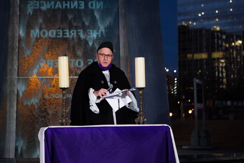 The Rev. Ed Bacon, interim rector of St. Luke’s Episcopal Church, speaks during an Atlanta peace vigil on Sunday, January 3, 2021, outside the National Center for Civil and Human Rights in Atlanta. Faith and community leaders lead the candlelight pre-election interfaith vigil as a way to mitigate violence and promote unity ahead of the U.S. Senate run-off election. CHRISTINA MATACOTTA FOR THE ATLANTA JOURNAL-CONSTITUTION