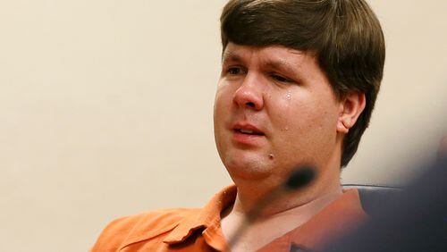 A tear rolls down the cheek of Justin Ross Harris, the father of a toddler who died after police say he was left in a hot car for about seven hours, as he sits during his bond hearing in Cobb County Magistrate Court, Thursday, July 3, 2014, in Marietta, Ga. Harris who police say intentionally killed his toddler son by leaving the boy inside a hot SUV was exchanging nude photos with women the day his son died and had looked at websites that advocated against having children, a detective testified Thursday. At that same hearing, a judge refused to grant bond for Harris, meaning he will remain in jail. (AP Photo/Marietta Daily Journal, Kelly J. Huff, Pool)