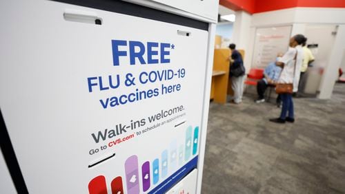 A COVID-19 sign is seen inside the CVS at North Decatur on Wednesday, Sept. 13. 2023. On Monday, the Food and Drug Administration approved the revised vaccines, anticipating their arrival shortly after a surge in COVID cases during the summer and just before the onset of flu season.Miguel Martinez /miguel.martinezjimenez@ajc.com