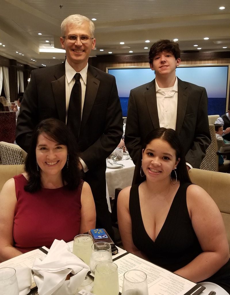 Tom and Debbie Crittenden are shown with their children, Lexy and Mark, whom they adopted in late 2017, on a 2019 fall break cruise. CONTRIBUTED