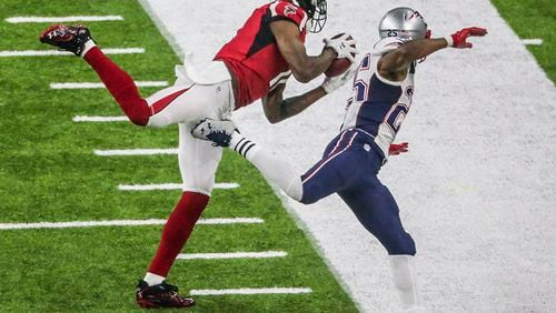 Julio Jones gets his first foot down as he makes an impressive catch over Patriots defender Eric Rowe  during Super Bowl LI Feb. 5, 2017, at NRG Stadium in Houston.