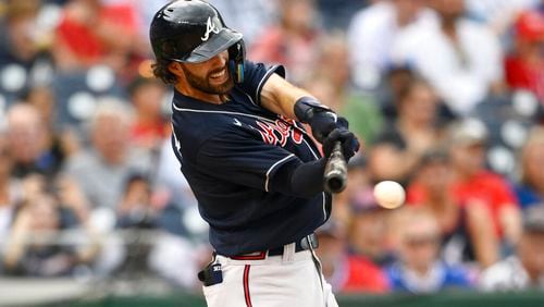 Atlanta Braves' Dansby Swanson in action during a baseball game against the Washington Nationals, Saturday, July 16, 2022, in Washington. (AP Photo/Nick Wass)