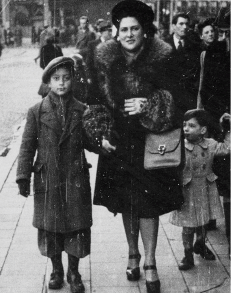 George Rishfeld, left, with his mother, Lucy, in Belgium after World War II.