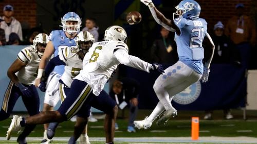 Georgia Tech defensive lineman Keion White (6) breaks up a pass intended for North Carolina running back Elijah Green (21) during the second half of an NCAA college football game, Saturday, Nov. 19, 2022, in Chapel Hill, N.C. (AP Photo/Chris Seward)