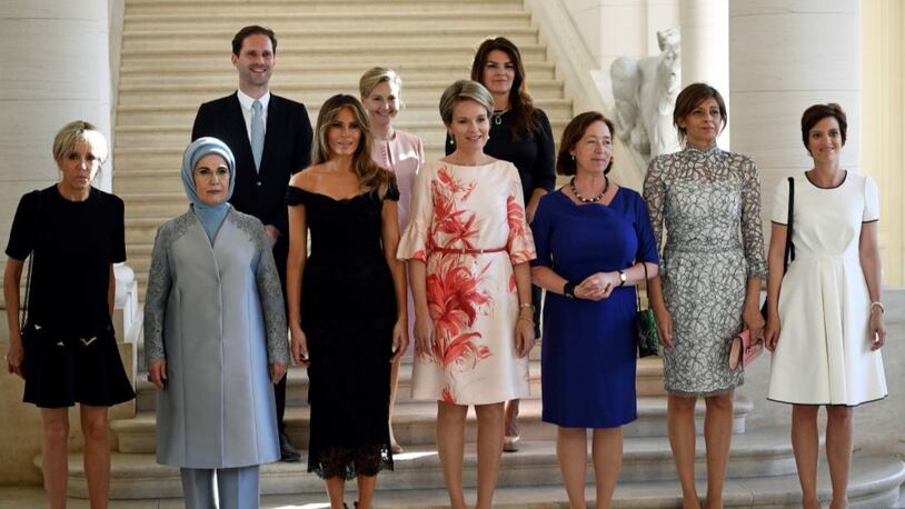 (Front row LtoR) First Lady of France Brigitte Macron, First Lady of Turkey Emine Gulbaran Erdogan, First Lady of the US Melania Trump, Queen Mathilde of Belgium, Stoltenberg's partner Ingrid Schulerud, Partner of Bulgaria's President Desislava Radeva, partner of Charles Michel Amelie Derbaudrenghien, (back row, LtoR) First Gentleman of Luxembourg Gauthier Destenay, partner of Slovenia's Prime Minister Mojca Stropnik and First Lady of Iceland Thora Margret Baldvinsdottir pose for a family photo before a diner of the First Ladies and Queen at the Royal castle in Laken/Laeken, on May 25, 2017, in Brussels. / AFP PHOTO / BELGA / YORICK JANSENS / Belgium OUT        (Photo credit should read YORICK JANSENS/AFP/Getty Images)