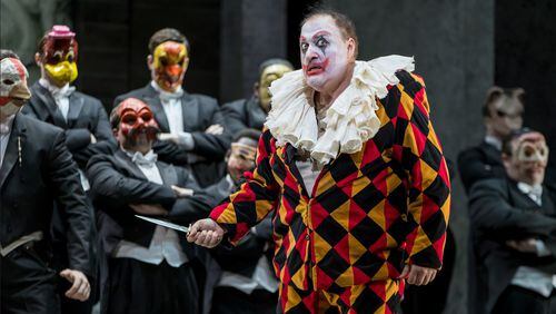 Rigoletto (George Gagnidze), masked as a clown, allows both the wearer and the world at large to detach from the reality of his humanity. Photo: Rafterman / Courtesy of the Atlanta Opera