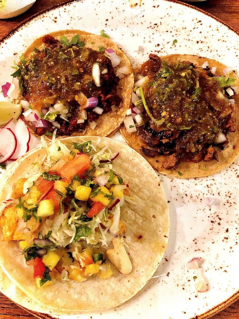 A trio of mix-and-match tacos at Patria Cocina (clockwise from upper left): chorizo, al pastor and fried fish. CONTRIBUTED BY WENDELL BROCK