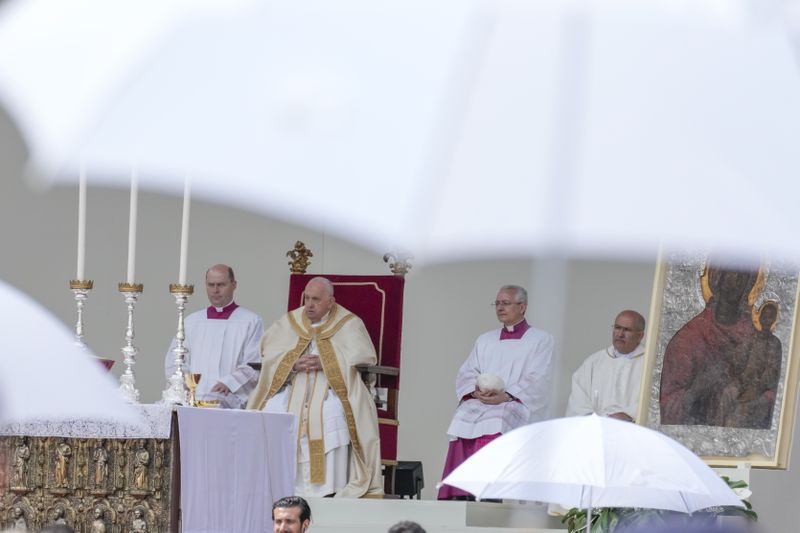 Pope Francis celebrates a mass in St. Mark's Square, Venice, Italy, Sunday, April 28, 2024. The Pontiff arrived for his first-ever visit to the lagoon town including the Vatican pavilion at the 60th Biennal of Arts. (AP Photo/Antonio Calanni)