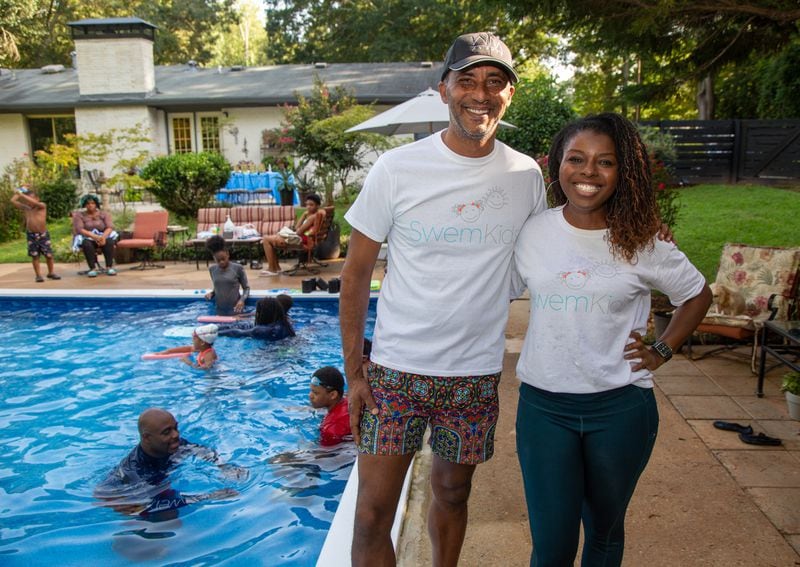 Pool owner William Fogler stands with Trish Miller of SwemKids. After COVID shuttered pools, a Fayetteville man offered his backyard pool for swimming instruction and water safety lessons to Atlanta city kids. SwemKids is a nonprofit that offers free swimming gear and lessons as an in-school program for kids in low income neighborhoods.  PHIL SKINNER FOR THE ATLANTA JOURNAL-CONSTITUTION.