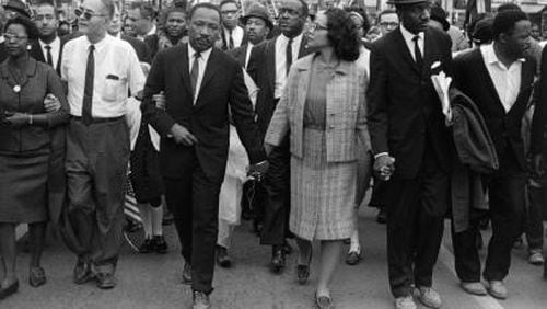 Morton Broffman photographed the Rev. Martin Luther King Jr. and Coretta Scott King leading the 1965 voting rights march into Montgomery. The High Museum liked it so much that it blew up the image and put it on a banner to promote the exhibition.