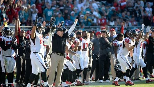 Here's a picture of the Falcons' players and coaches celebrating their tiebreaker situation. No, not really. (AP photo)