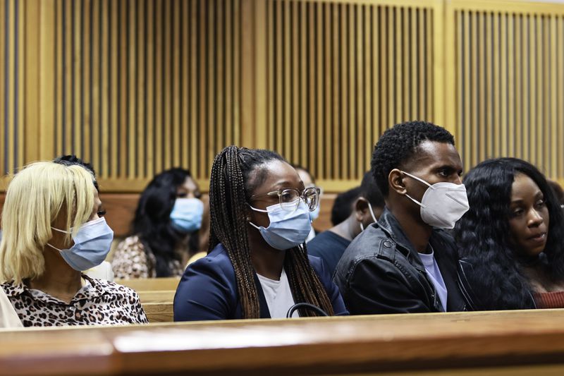 Family members of Kennedy Maxie listen to the judge sentence Daquan Reed on Monday.
