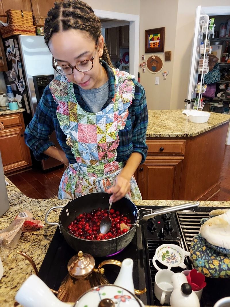 AJC reporter Mirtha Donastorg makes cranberry sauce on Thanksgiving in November 2020.