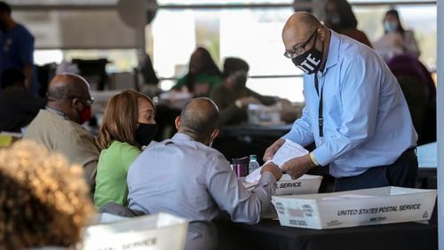 Fulton County election workers started counting and scanning ballots again Wednesday as the state and the nation waited for the results. (John Spink / John.Spink@ajc.com)