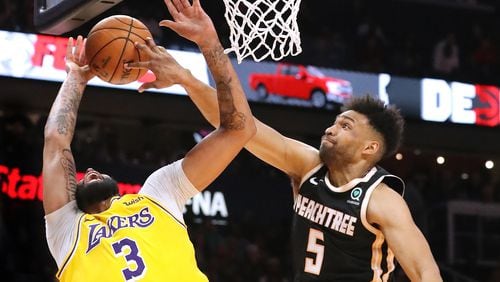 The Hawks Jabari Parker has a shining moment of defense, blocking the shot of the Los Angeles Lakers Anthony Davis.