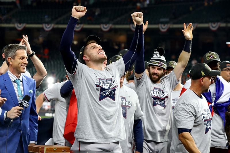  Braves first baseman Freddie Freeman and shortstop Dansby Swanson (7) celebrate after defeating the Houston Astros 7-0 in game six of the World Series at Minute Maid Park, Tuesday, November 2, 2021, in Houston, Tx. The Atlanta Braves beats the Houston Astros 4-2 to take the World Series. Curtis Compton / curtis.compton@ajc.com