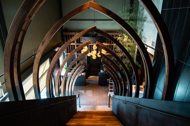 The central design element at Arnette’s Chop Shop is a spectacular rib-cage staircase leading to the second-floor bar and patio. CONTRIBUTED BY HENRI HOLLIS
