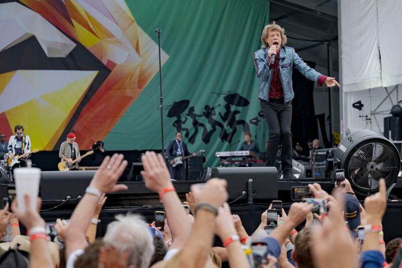 Mick Jagger, right, Ronnie Wood, left, and Keith Richards, of the Rolling Stones, perform during the New Orleans Jazz and Heritage Festival in New Orleans, Thursday, May 2, 2024. (AP Photo/Matthew Hinton)