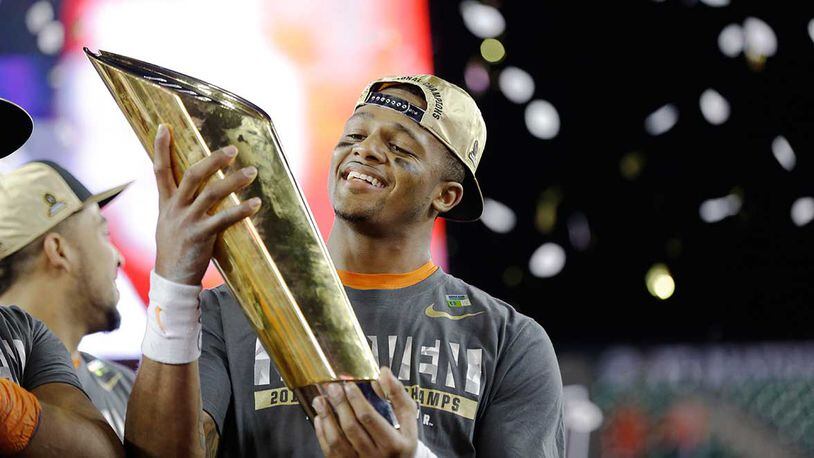 Gainesville, Ga. native DeShaun Watson holds the championship trophy after leading Clemson to a 35-31 victory over Alabama Monday in the college football playoff national championship game.