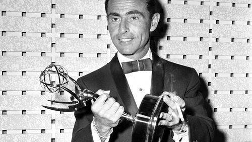 FILE - Writer Rod Serling holds the Emmy for best writing of a drama series for his work on "The Twilight Zone," at the Emmy Awards in Los Angeles on May 16, 1961. (AP Photo, File)