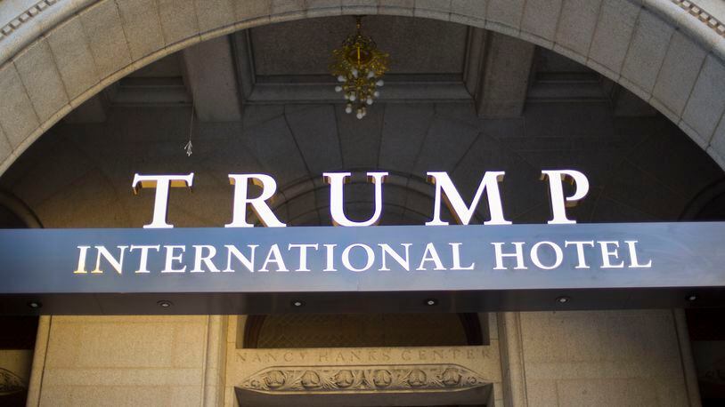 FILE - This Monday, Sept. 12, 2016, file photo, shows the exterior of the Trump International Hotel in downtown Washington. Experts on government ethics are warning President-elect Donald Trump that hell never shake suspicions of a clash between his private interests and the public good if he doesnt sell off his vast holdings, which include roughly 500 companies in more than a dozen countries. They say just the appearance of conflicts is likely to tie up the new administration in investigations, lawsuits and squabbles. (AP Photo/Pablo Martinez Monsivais, File)