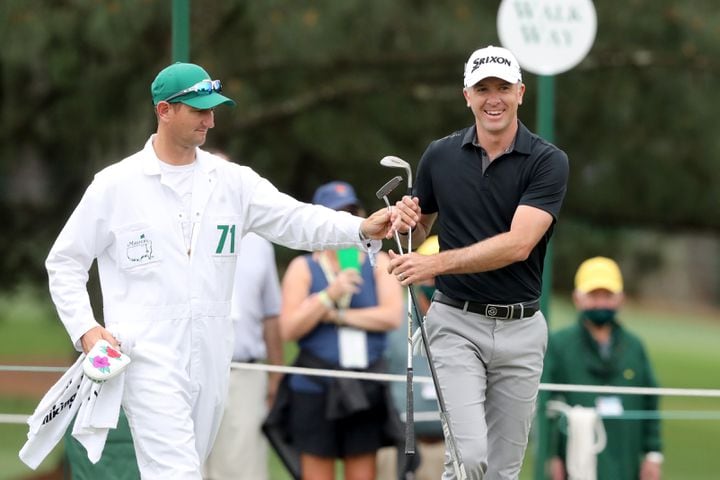 April 10, 2021, Augusta: Martin Laird reacts with his caddie Kevin McAlpine after a chip close to the hole on his way to a birdie on the second hole during the third round of the Masters at Augusta National Golf Club on Saturday, April 10, 2021, in Augusta. Curtis Compton/ccompton@ajc.com