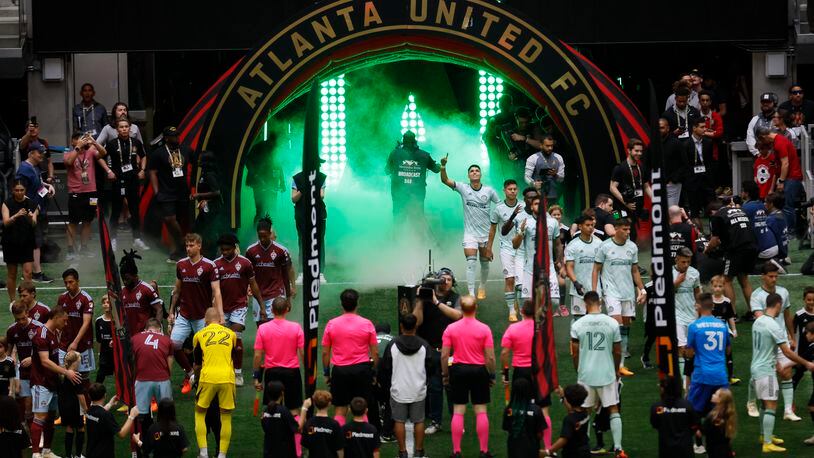 Atlanta United and Colorado Rapids step onto the field surrounded by smoke and green light as the team faces each other at Mercedes-Benz Stadium on Wednesday, May 17, 2023.
Miguel Martinez /miguel.martinezjimenez@ajc.com