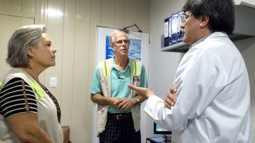 Wardens Berit(L) and Dan(C)Wick talk with Dr. Martin Caravajal(R) at a hospital in Cartagena, Colombia that takes care of many American travelers. The primary responsibility of wardens is to assist the U.S. Embassy in communication with the American community in the event of an emergency. Photo for The Washington Post by Andrea Sachs.