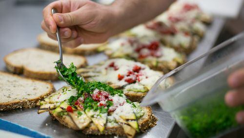 The chef assembles antipasti sandwiches at Crema Espresso in Dunwoody.