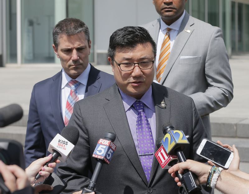 U.S. Attorney Byung J. “BJay” Pak, center, addresses the media earlier this month after former Kasim Reed aide Katrina Taylor-Parks became the second high-ranking Atlanta official to plead guilty in the federal corruption investigation of City Hall. BOB ANDRES /BANDRES@AJC.COM