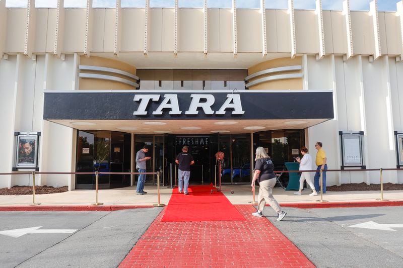 People enter the Tara Theatre in Atlanta on Thursday, May 25, 2023. The theater reopened after being shut down last November. (Natrice Miller/natrice.miller@ajc.com)
