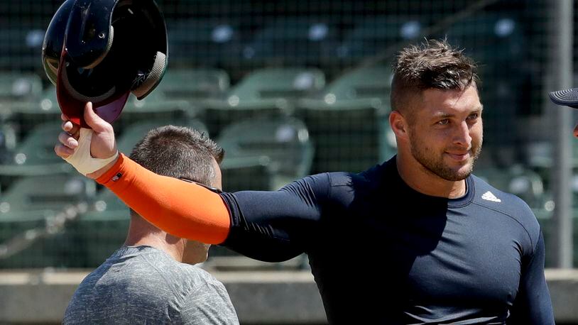 Former NFL quarterback Tim Tebow finishes his workout for baseball scouts on Tuesday, Aug. 30, 2016 in Los Angeles. (AP Photo/Chris Carlson)