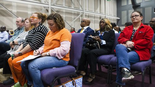 Anne Marie Reynolds, a Gwinnett County teacher, takes notes during a community meeting about recent school safety and discipline issues Nov. 2 at New Mercies Church in Lilburn. The school board discussed at a later meeting how policy implementation contributed to these concerns. (Christina Matacotta for The Atlanta Journal-Constitution)