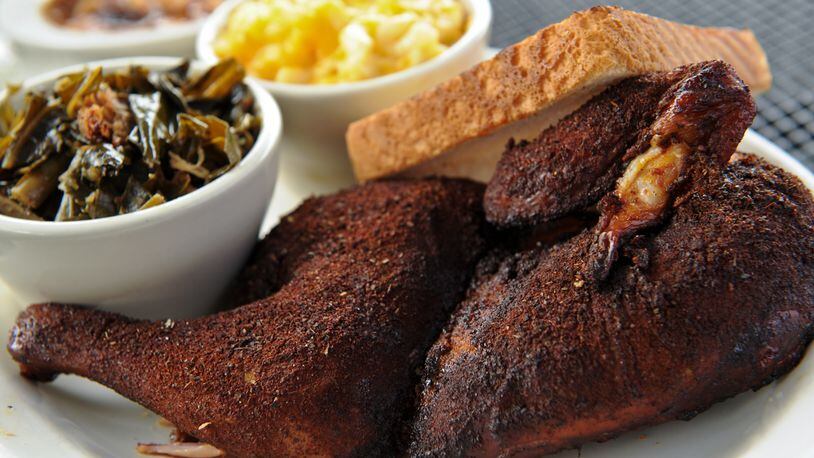 BBQ dry rub and smoked 1/2 chicken with mac n' cheese, collards and Brunswick stew at Greater Good BBQ / AJC file photo