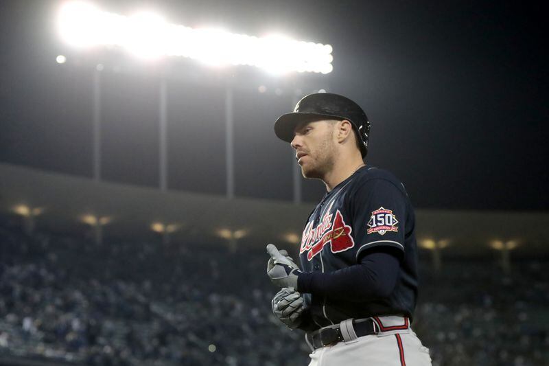 Braves first baseman Freddie Freeman walks off of the field after grounding out during the ninth inning. Curtis Compton / curtis.compton@ajc.com 