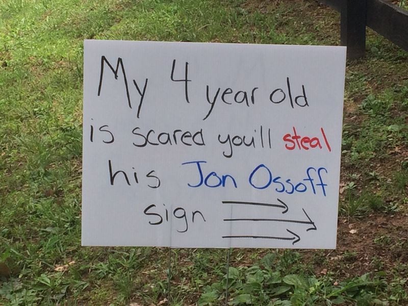 Barrett Walker’s son was upset when the first batch of Jon Ossoff signs was stolen off the family’s lawn in Roswell, as this sign -- part of a replacement batch -- suggests.