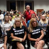 Ron Tripodo, center, yells at the Cherokee County School Board after they passed a resolution to ban teaching Critical Race Theory and then adjourned the meeting Thursday night, May 20, 2021 Tripodo was upset that the language in the resolution was ambiguous and didn’t really do anything. (Ben Gray for the Atlanta Journal-Constitution)