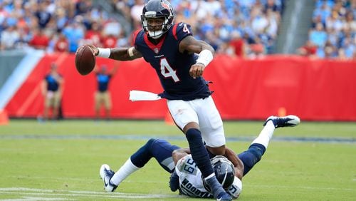 Deshaun Watson #4 of the Houston Texans runs with the ball against Wesley Woodyard #59 of the Tennessee Titans during the third quarter at Nissan Stadium on September 16, 2018 in Nashville, Tennessee.  (Photo by Andy Lyons/Getty Images)