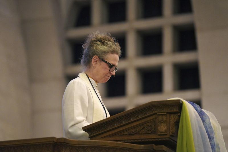 The Rev. Tracy Cox of First United Methodist Church gives a sermon on Sunday, April 14, 2024, in Pittsburgh. Three members of her church are set to attend the United Methodist General Conference in Charlotte, N.C. Many, including Rev. Cox, hope that this is the year they change longstanding bans on LGBTQ clergy and same-sex marriage. (AP Photo/Jessie Wardarski)