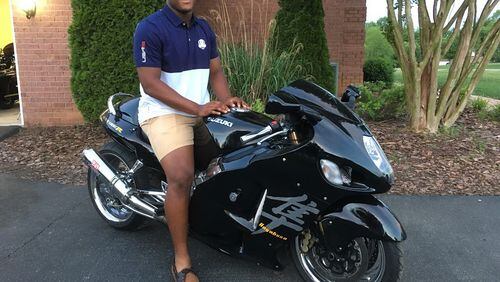 Georgia Tech freshman linebacker Justice Dingle astride his father's Suzuki Hayabusa motorcycle at the family's home in Bowling Green, Ky. Dingle said he wasn't planning on bringing it to campus. While the Hayabusa can reach speeds of nearly 200 miles per hour, Dingle said he doesn't go nearly that fast on it.