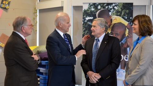 Vice President Joe Biden, second from left, talks with Sen. Sam Nunn, left, developer Tom Cousins and executive director of the East Lake Foundation, Carol Naughton at the East Lake Early Leaning Academy Tuesday March 4, 2014.