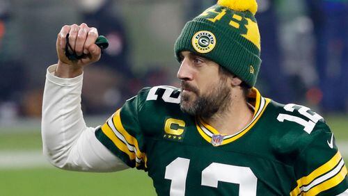 Green Bay Packers quarterback Aaron Rodgers pumps his first after an NFL divisional playoff football game against the Los Angeles Rams Saturday, Jan. 16, 2021, in Green Bay, Wis. The Packers defeated the Rams 32-18 to advance to the NFC championship game. (AP Photo/Mike Roemer)