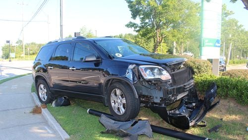 A motorcyclist died in a crash after running a red light and colliding with this SUV on Thursday morning, police said.