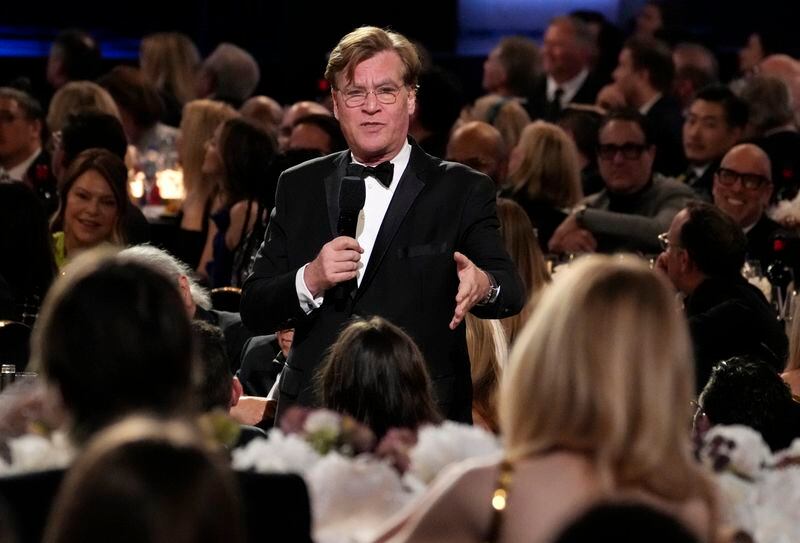 Writer/director Aaron Sorkin speaks about actor Nicole Kidman, foreground right, during the 49th AFI Life Achievement Award tribute to her, Saturday, April 27, 2024, at the Dolby Theatre in Los Angeles. (AP Photo/Chris Pizzello)