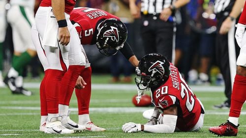 Falcons' Kendall Sheffield goes down with an injury during an exhibition game against the New York Jets Thursday, Aug. 15, 2019, at Mercedes-Benz stadium in Atlanta.